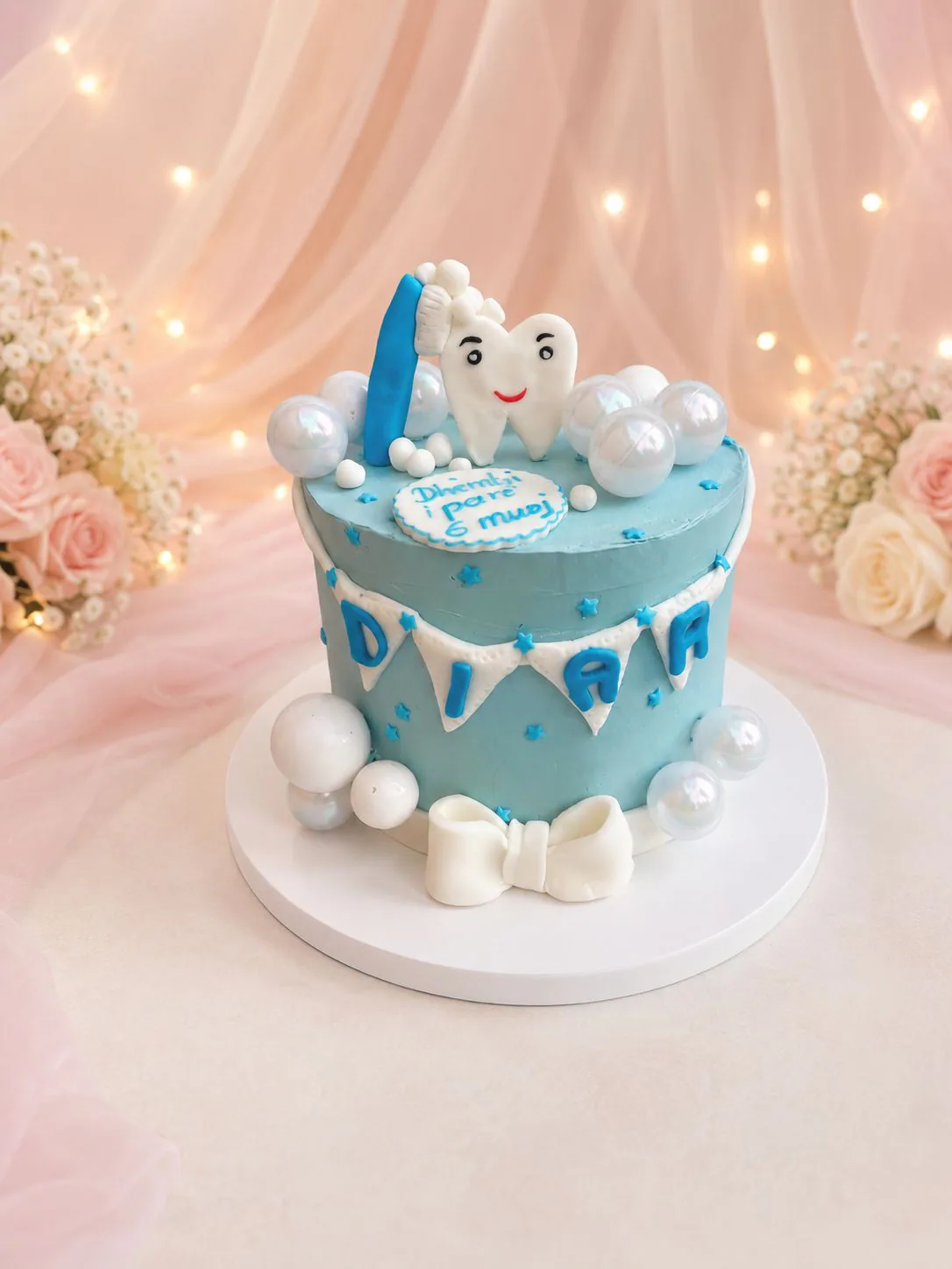 Blue first tooth celebration cake handmade by Anila in Norwich