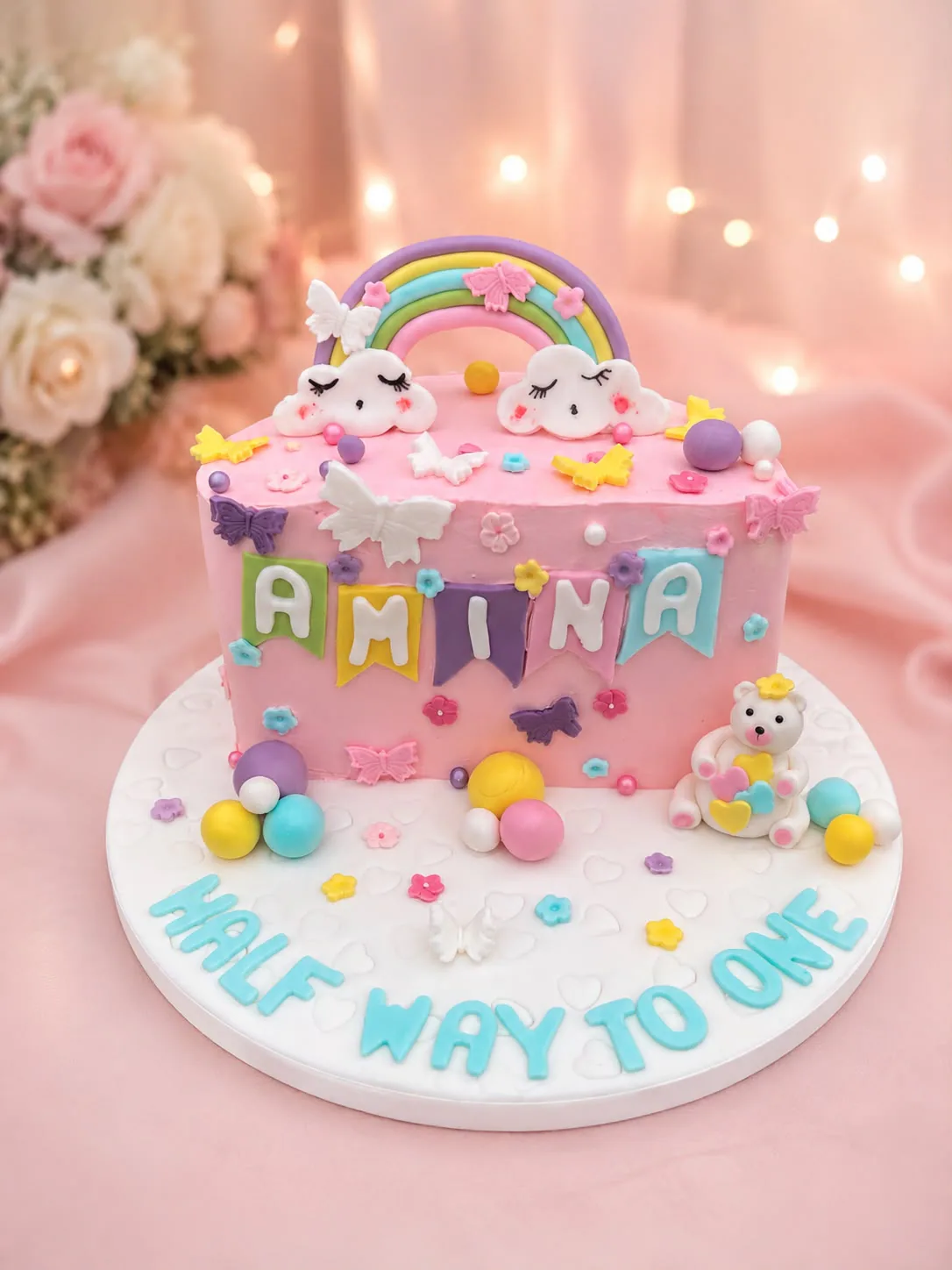 Children’s pink rainbow first birthday cake handmade by Anila in Norwich
