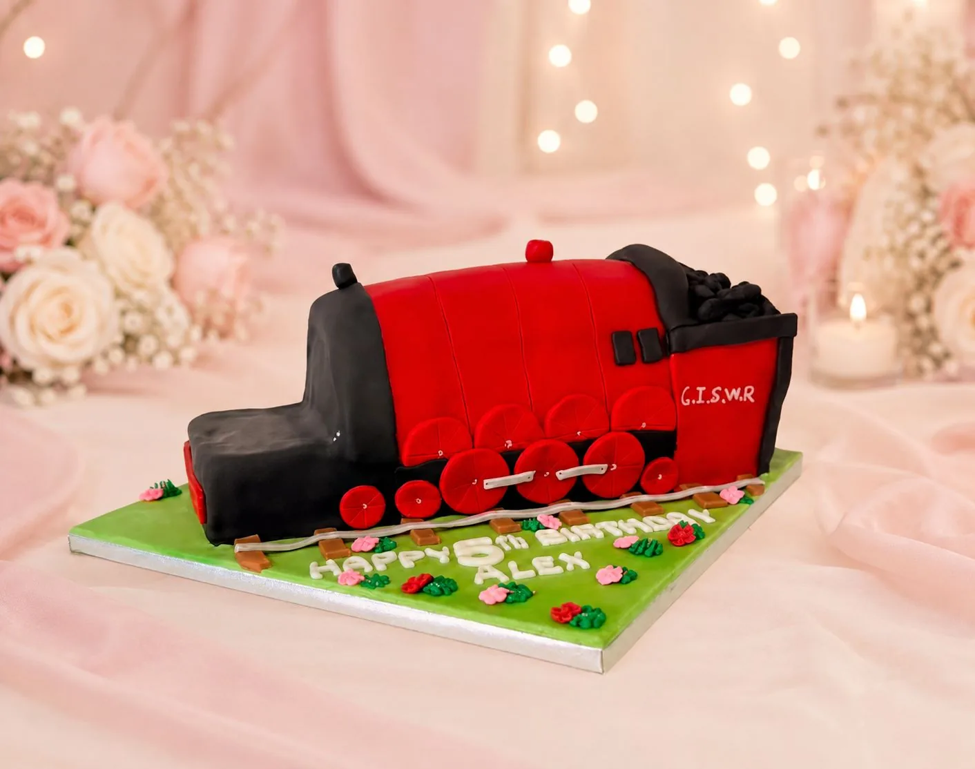 Red steam train birthday cake handmade by Anila in Norwich