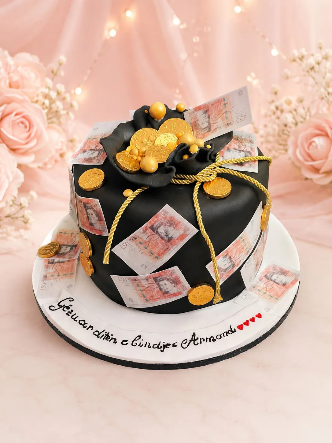 Black and gold money bag cake handmade by Anila in Norwich